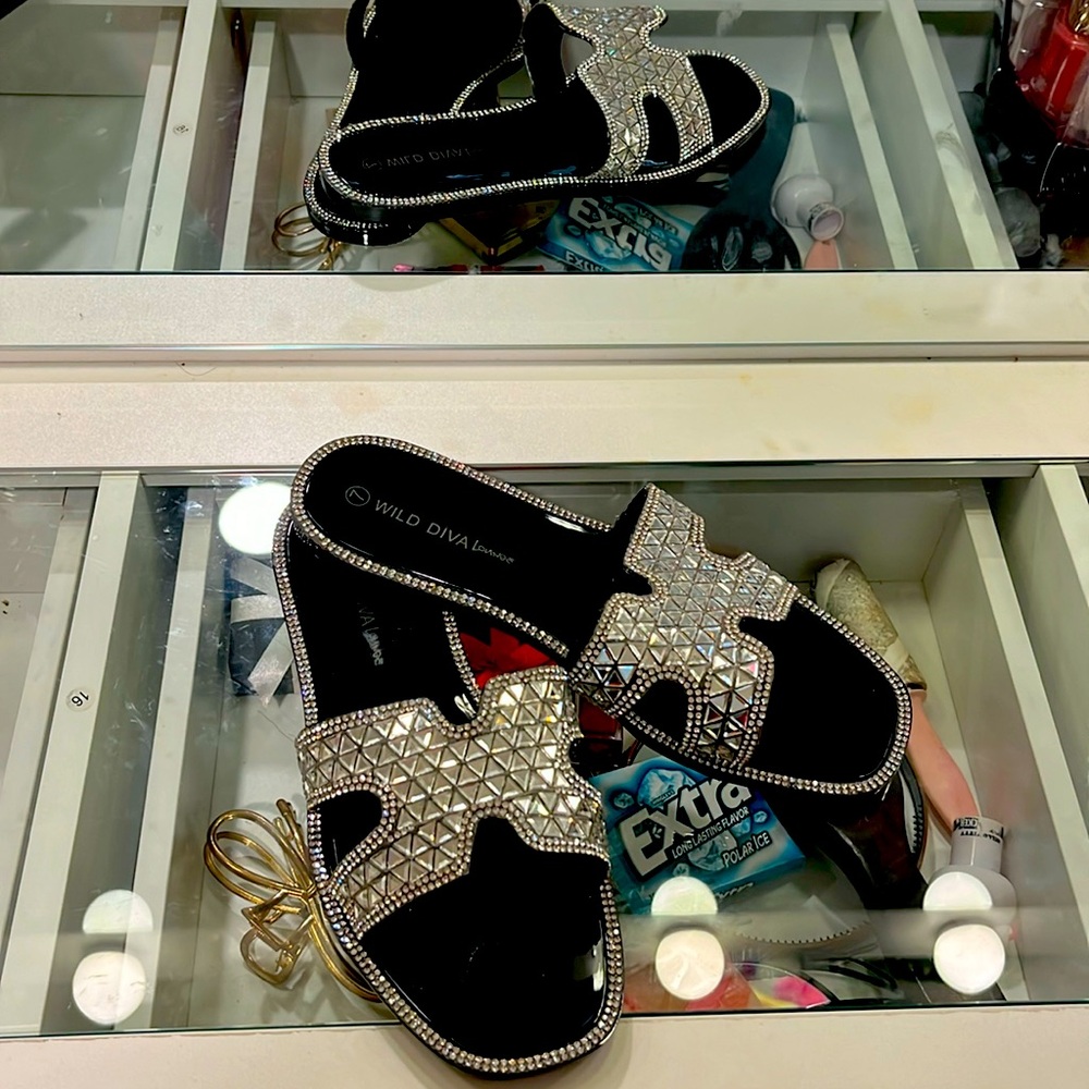 Black and silver sandels Never Used it fit to small and i just never returned it